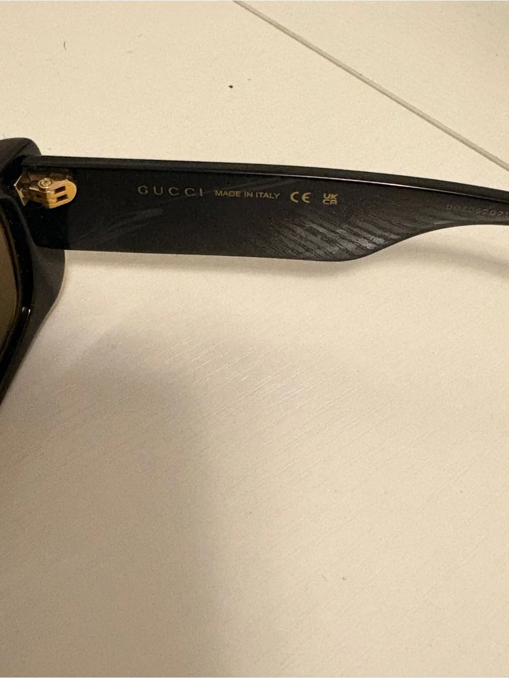 Gucci Black Sunglasses with Gold Accent Logo